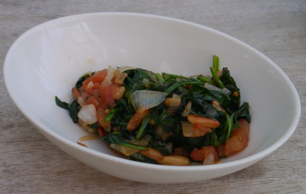 Sauteed spinach with tomato and pinenuts